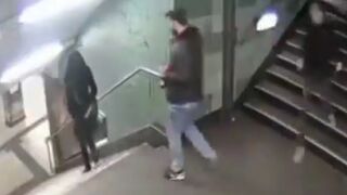 Migrant or Asshole Sparta Kicks Business Woman down Stairs in Subway Tunnel
