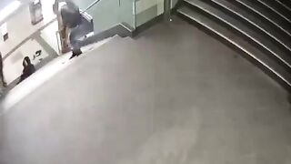 Migrant or Asshole Sparta Kicks Business Woman down Stairs in Subway Tunnel
