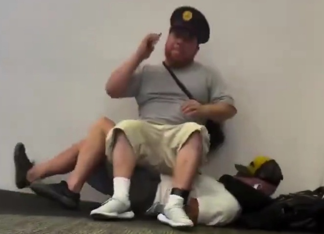 Guy finds an unusual place to sit in the airport