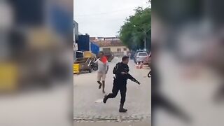Police cannot Arrest a Man with a Knife until a Local Knocks Him with a Coconut