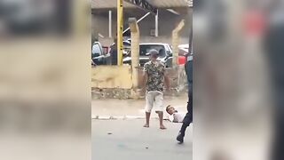 Police cannot Arrest a Man with a Knife until a Local Knocks Him with a Coconut