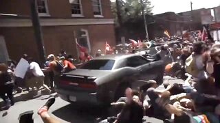 Car Runs Over Dozens of People Blocking the Street, then Reverses