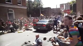 Car Runs Over Dozens of People Blocking the Street, then Reverses