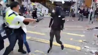 Hong Kong Police don't Mess Around..Kill Protestors trying to Grab his Gun