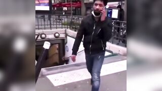 In France, Migrant on his Phone just Casually Pushes Woman Down Concrete Steps