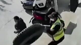 China: A security Guard is Hit by a Runaway Tire..Couple Seconds to Live