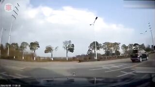 Motorcyclist is Blown Away after Collision and then Run Over