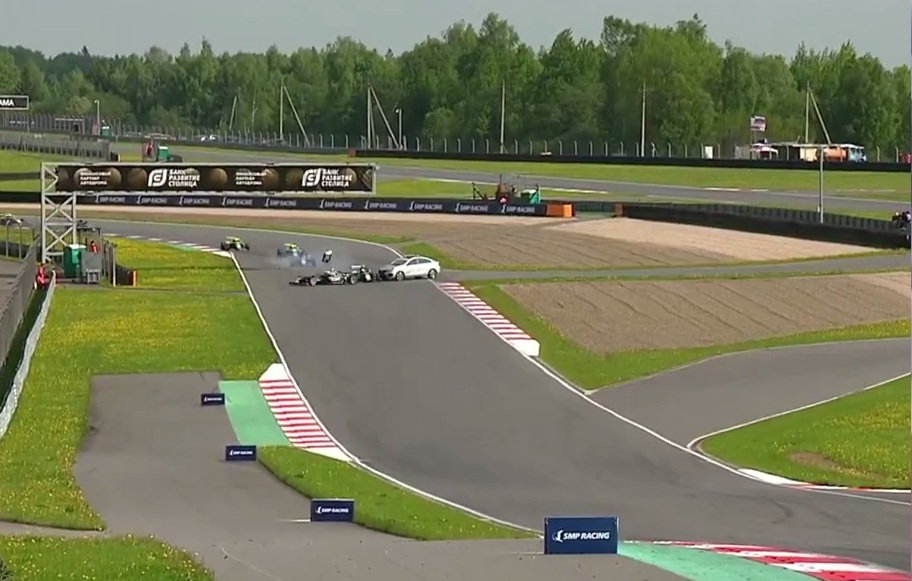 a "Genius" driving the safety car pulled onto the track directly in front of the speeding race cars.