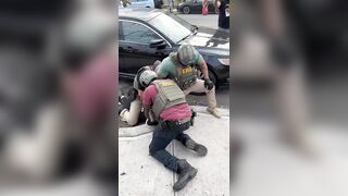ICE agents pursue, tackle and arrest a far leftist agitator who threw an umbrella into a crowd of agents
