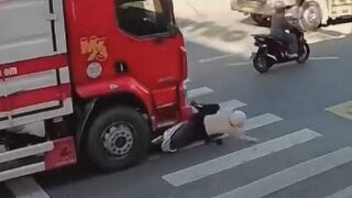 Millimeters from Death: Woman Cheats Crushing Fate Beneath Truck Wheels