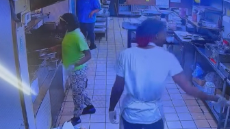 A woman throws hot grease on coworker after having words