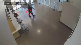 Arizona police shoot woman armed with gun in lobby