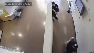 Arizona police shoot woman armed with gun in lobby