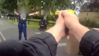 Moment UK police use stun guns on man with large knife