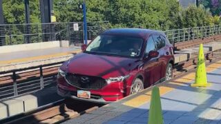 Car drives onto light rail tracks at Seattle's Mount Baker station