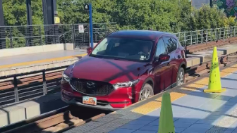 Car drives onto light rail tracks at Seattle's Mount Baker station