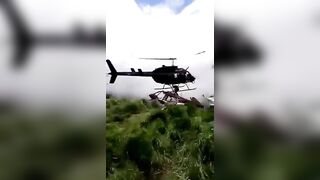 Helicopter Crash Survivors are Killed by Rescuing Helicopter Watch Man in White get Hit by Propellor