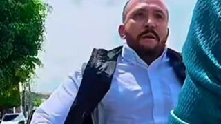bald thug got out in a rage and brutally beat a cyclist in the middle of the street.