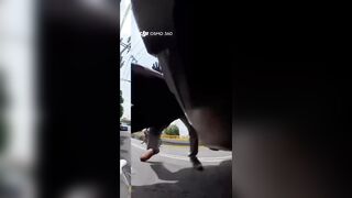bald thug got out in a rage and brutally beat a cyclist in the middle of the street.
