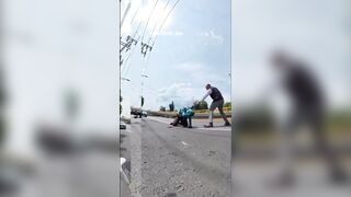 bald thug got out in a rage and brutally beat a cyclist in the middle of the street.