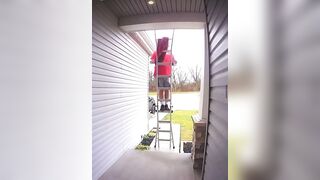 A stupid man falls from his ladder