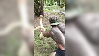 The snake just stood up and squared up to the dude! Balls of Steel!