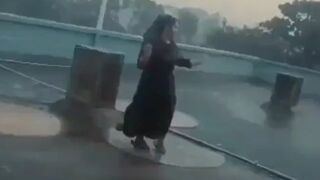 Muslim Woman Dancing in the Rain is Struck by Lightening Running back but Too Late
