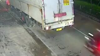 Watch the Back of the Truck, Motorcyclist Loses his Head