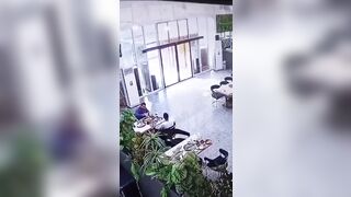 2 Men Eating Breakfast get an Unwanted Intruder on the Table