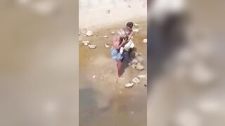 Young Kid tries to Help Older man being Strangled to Death by Giant Snake