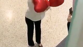Woman deep throats the longest balloon ever