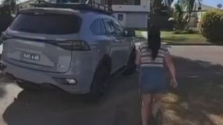 Woman tries to run after her car as it is stolen out of her driveway, and the thieves take off with her baby in the car.