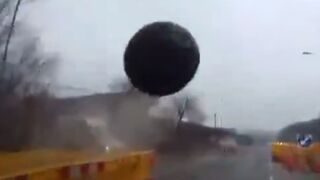 Wrecking Ball at construction Site enters Vehicle