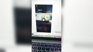 Black mother cover the bed with her newborn in piles of cash and thrown cash into air