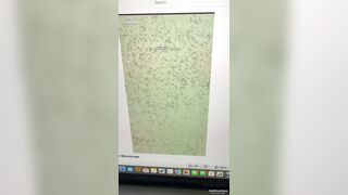Black mother cover the bed with her newborn in piles of cash and thrown cash into air