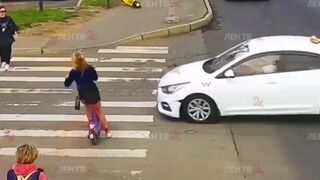 Young Scooter Girl has not yet Learned Traffic Rules