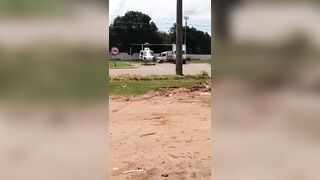 Oh No...Helicopter Parked and Running in the road, Blades hit a Passing Truck