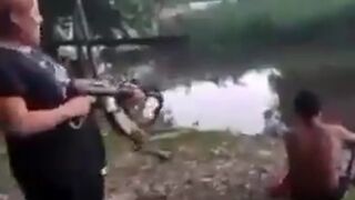 Female Cartel Member joins In on Blowing Man's Head off with High Powered Weaponry Laughing