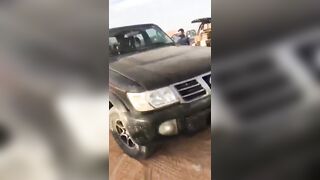 Muslim has a Perfect Landing under the Car