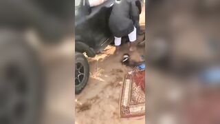 Muslim has a Perfect Landing under the Car