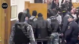 LOL: One of the Captured Terrorists Wheeled out Unconscious to Appear in Court.