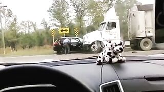 Perfect angle: Car collides head on with stopped truck