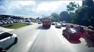 Truck crosses Center of Highway and Takes out Entire Line of Cars caught in Traffic Jam