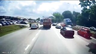 Truck crosses Center of Highway and Takes out Entire Line of Cars caught in Traffic Jam