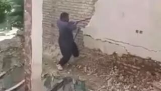 Guy trying to Knock Down a Wall Does So Successfully..It causes his own Death