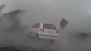 Amazing Power of a Tornado makes Car Disappear and Tosses its Occupant