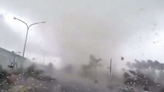 Amazing Power of a Tornado makes Car Disappear and Tosses its Occupant