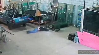 Employee can't Hold up and is Crushed by Glass Panels