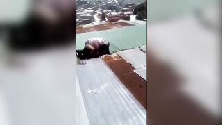 Girls Fighting on Roof of a Poorly Built Building Fall right on Through