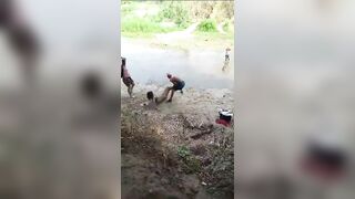 Man Smacks Woman with a Log and then Throws her into the River Venezuela (See Info)